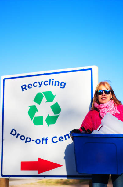istock Woman with Big Bin Recycling at Drop-Off Center 867634990