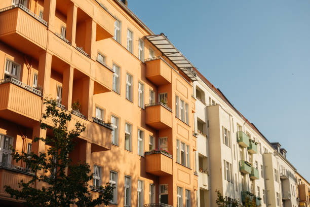 istock orange and white houses in a row 867644964