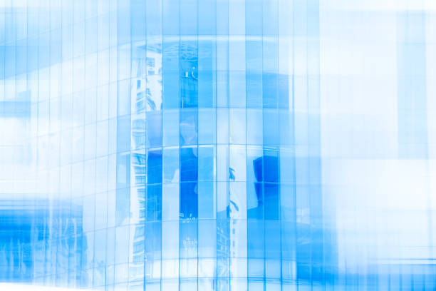 istock High glass modern building with blue sky and cloud at daylight for abstract background. Soft focus.Facades texture pattern for business background. 867645466