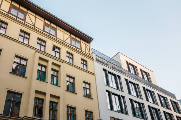 istock orange and white modern apartments exterior 867645536