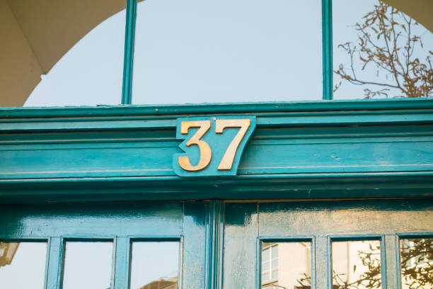 istock number 37 sign on green door 867647822