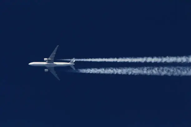 Boeing 777 civil airliner flying on high altitude.