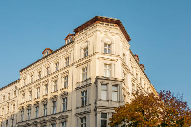 istock residential corner building with autumn tree 867648752