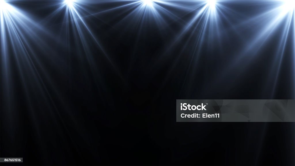 spotlights lighting flare on a dark background, abstract Illuminated Stock Photo