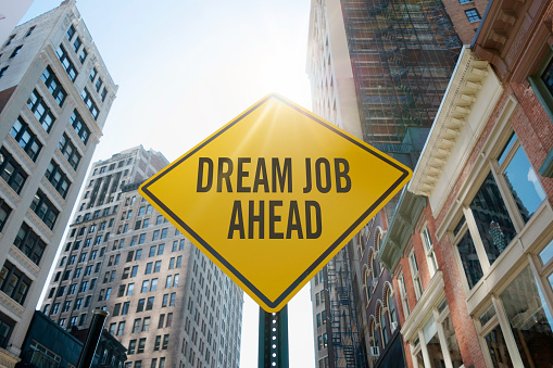 Road sign quoting “dream job ahead”