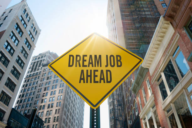 "dream job ahead" traffic sign stock photo