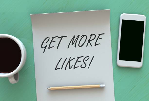 istock Get More Likes, message on paper, smart phone and coffee on table 867657428