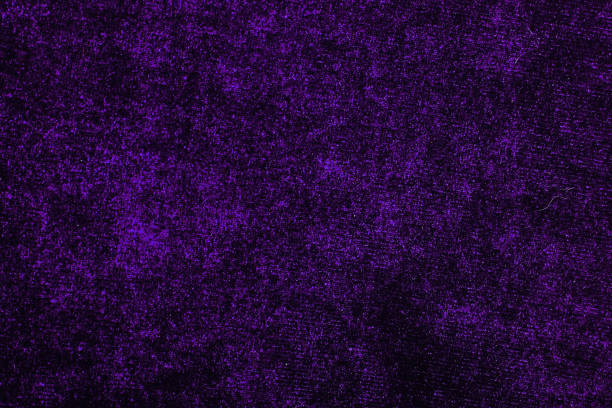 istock Purple Velvet dress fabrics material cloth texture pattern. tailoring stitching concept. Shiny beautiful fashion fabric. Shiny clothing material sample.Creased fabric 867657656