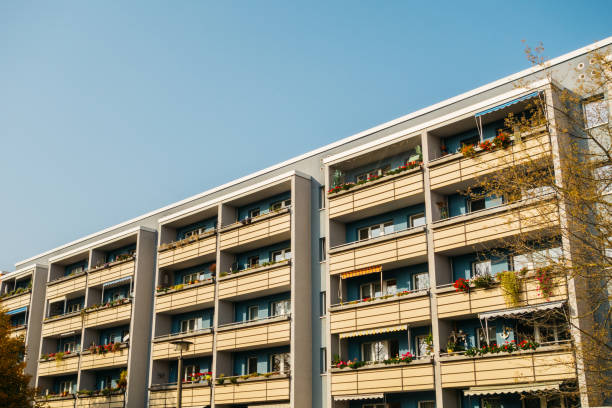 istock grey plattenbau building with yellow balcony 867657936