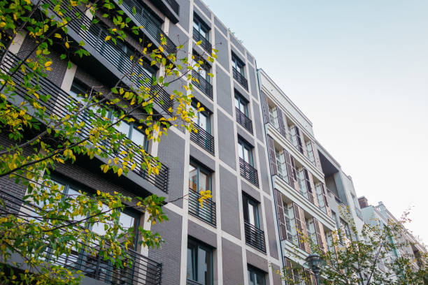 istock darken building with green tree in the front 867660992