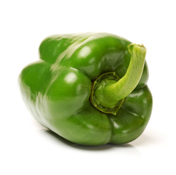 istock One green bell pepper isolated on a plain white background 867661014