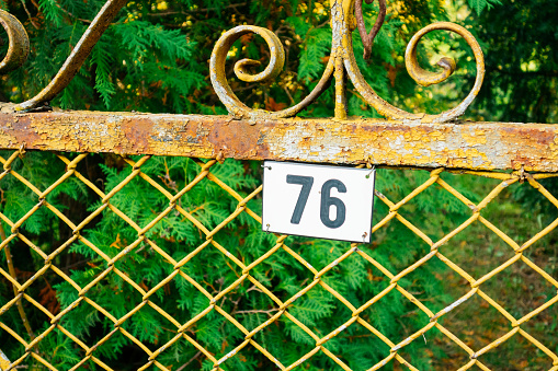 number 76 garden door sign