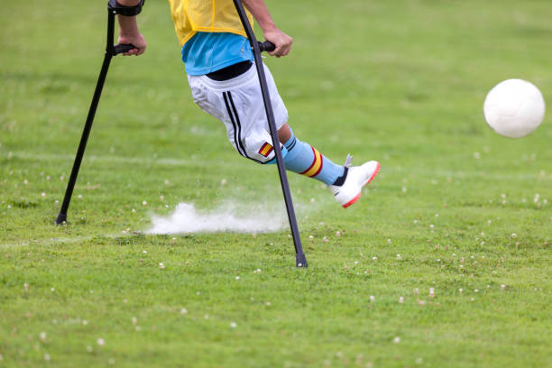 istock Amputee Soccer Player Kicking The Ball 867667586