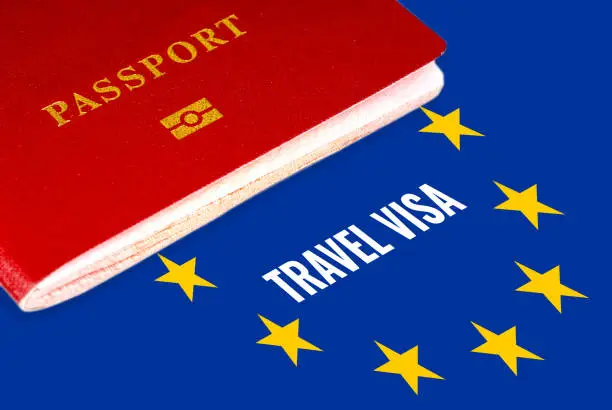 travel visa, white text over eu flag and passport