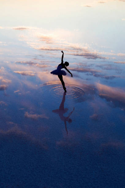 istock young ballet dancing on the lake in the evening 867667808