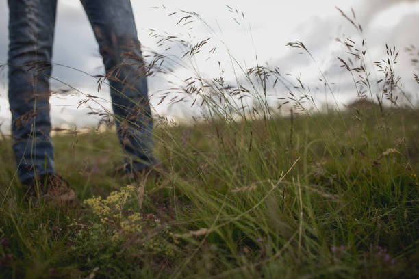 istock Female standing on green grass 867672550