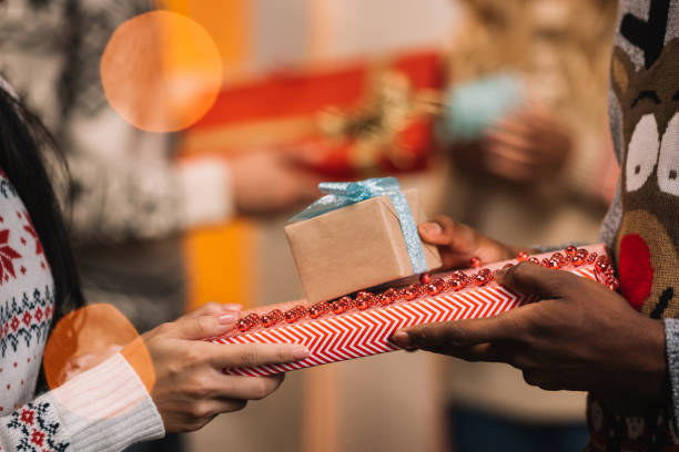 istock couple exchanging christmas gifts 867678650