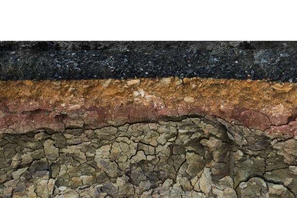 istock The layer of asphalt road with soil and rock. 867678712