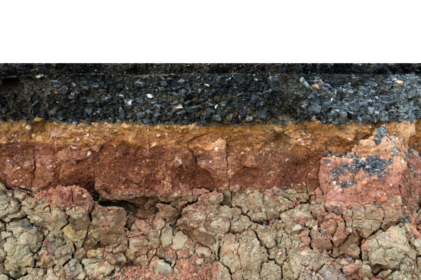 istock The layer of asphalt road with soil and rock. 867678862
