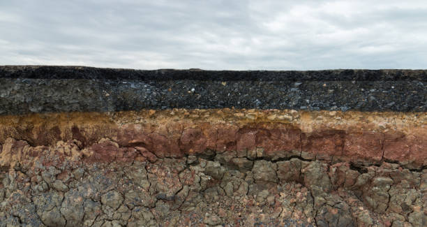 The layer of asphalt road with soil and rock. stock photo