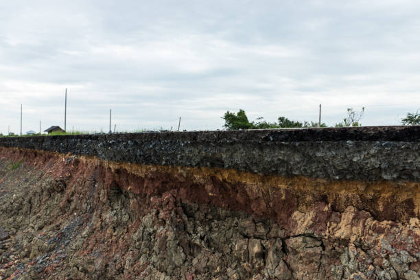istock The layer of asphalt road with soil and rock. 867678980