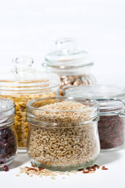assortment of various cereals and legumes on white background, closeup