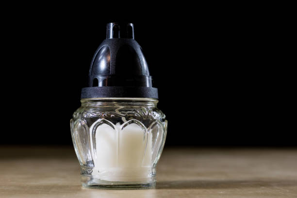 istock Ordinary candle to ignite on the grave 867685744