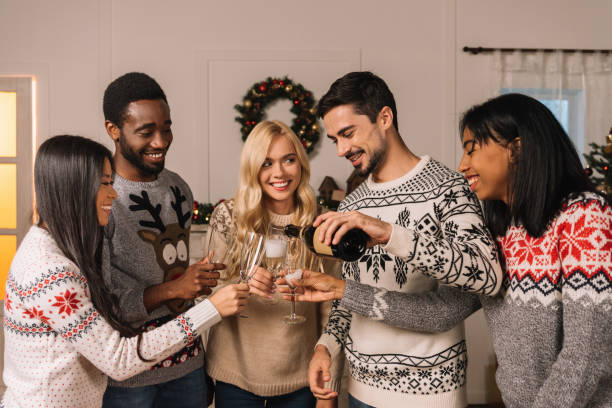 istock multicultural friends with champagne celebrating christmas 867686164