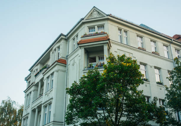 istock grey old apartment building in vintage colors 867686362