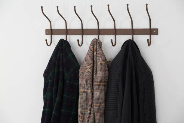 istock Close-up of warm clothes hanging on hook 867689506