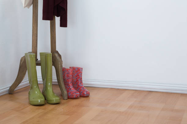istock Wellington boots on wooden floor 867689612
