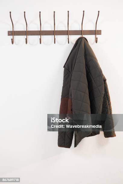 Closeup Of Warm Cloth Hanging On Hook Stock Photo - Download Image Now - Hanging, Jacket, Hook - Equipment