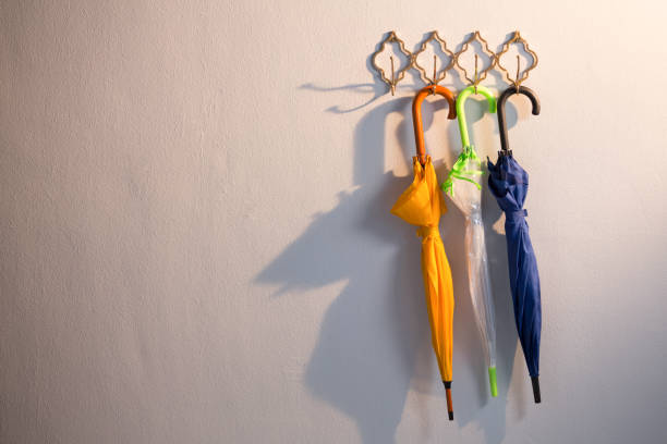 istock Colorful umbrellas hanging on hook 867689744