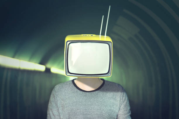 istock surreal addicted man with television on his head 867689992