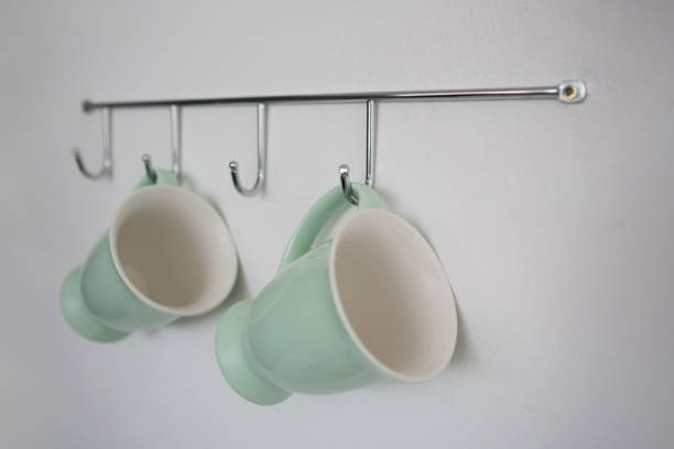 istock Close-up of mugs hanging on hook 867692608