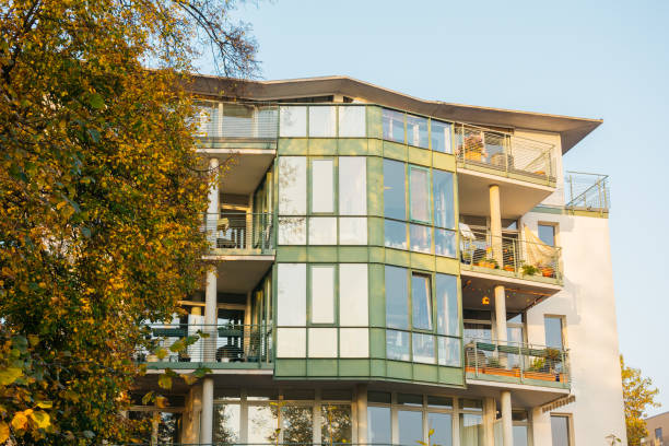 istock green facaded house with tree on the side 867692752