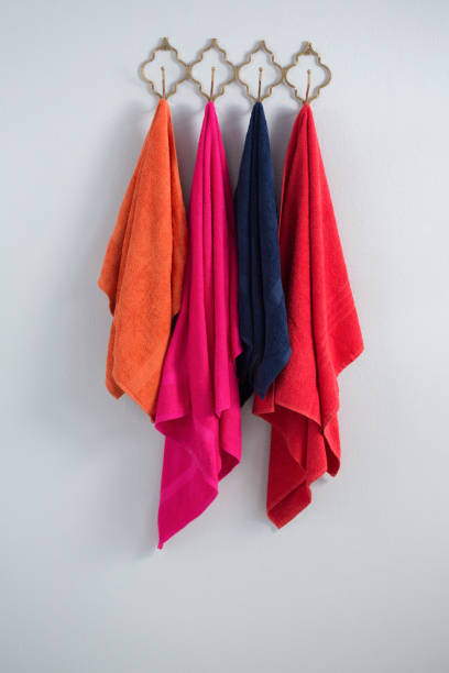 istock Colorful towels hanging on hook 867692810