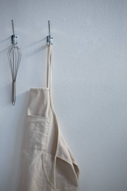 istock Apron and whisker hanging on hook 867692932