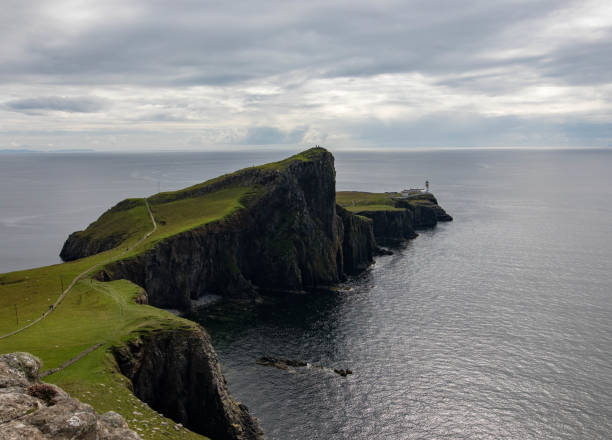 istock Neist Point and lighthouse on Isle of Skye, Scotland 867693316