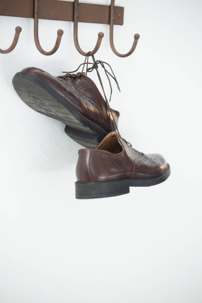 istock Pair of shoes hanging on hook 867695780