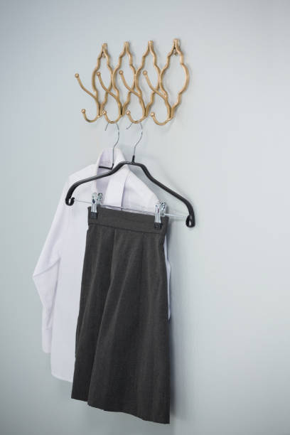 istock Formal shirt and skirt hanging on hook 867695850