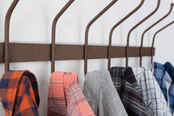 istock Close-up of various shirts hanging on hook 867696114