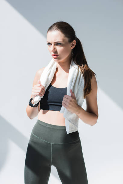 istock athletic woman with towel 867696674