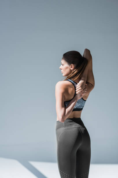 istock sporty woman stretching hands 867697166