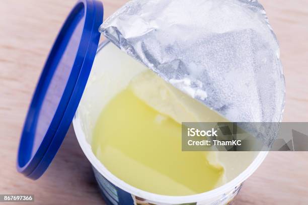 Layer Of Whey Protein Formed On Top Of Packaged Yogurt Stock Photo - Download Image Now