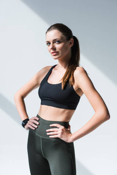istock athletic girl standing with hands on waist 867697444