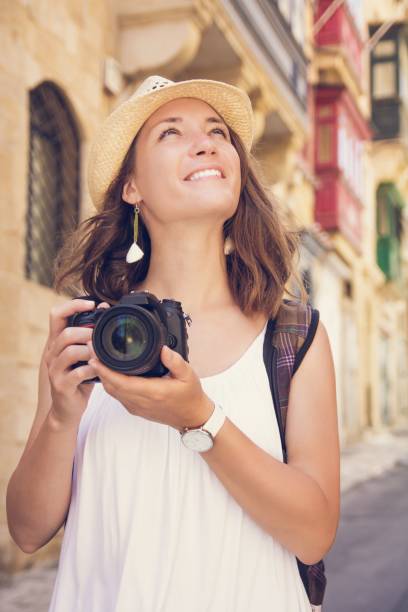 istock Young woman tourist with camera sightseeing in Valletta, Malta 867698018