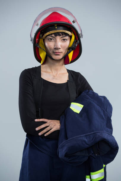 istock Female architect wearing helmet against white background 867700466