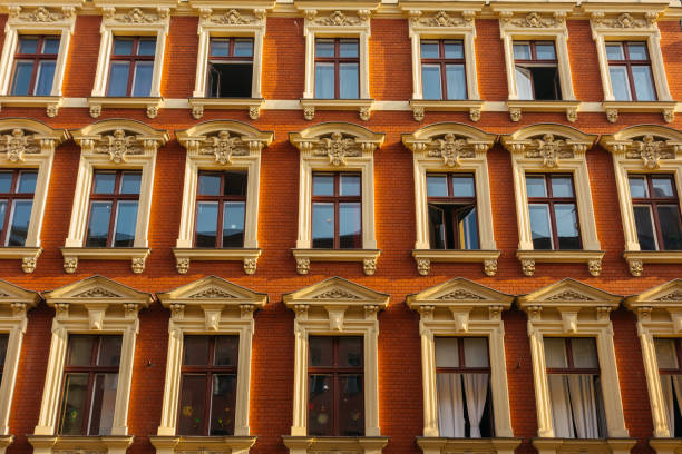 istock red facaded brick apartment building with stucco windows 867700886