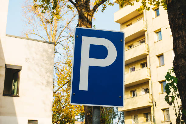 istock blue parking sign on house background 867704434